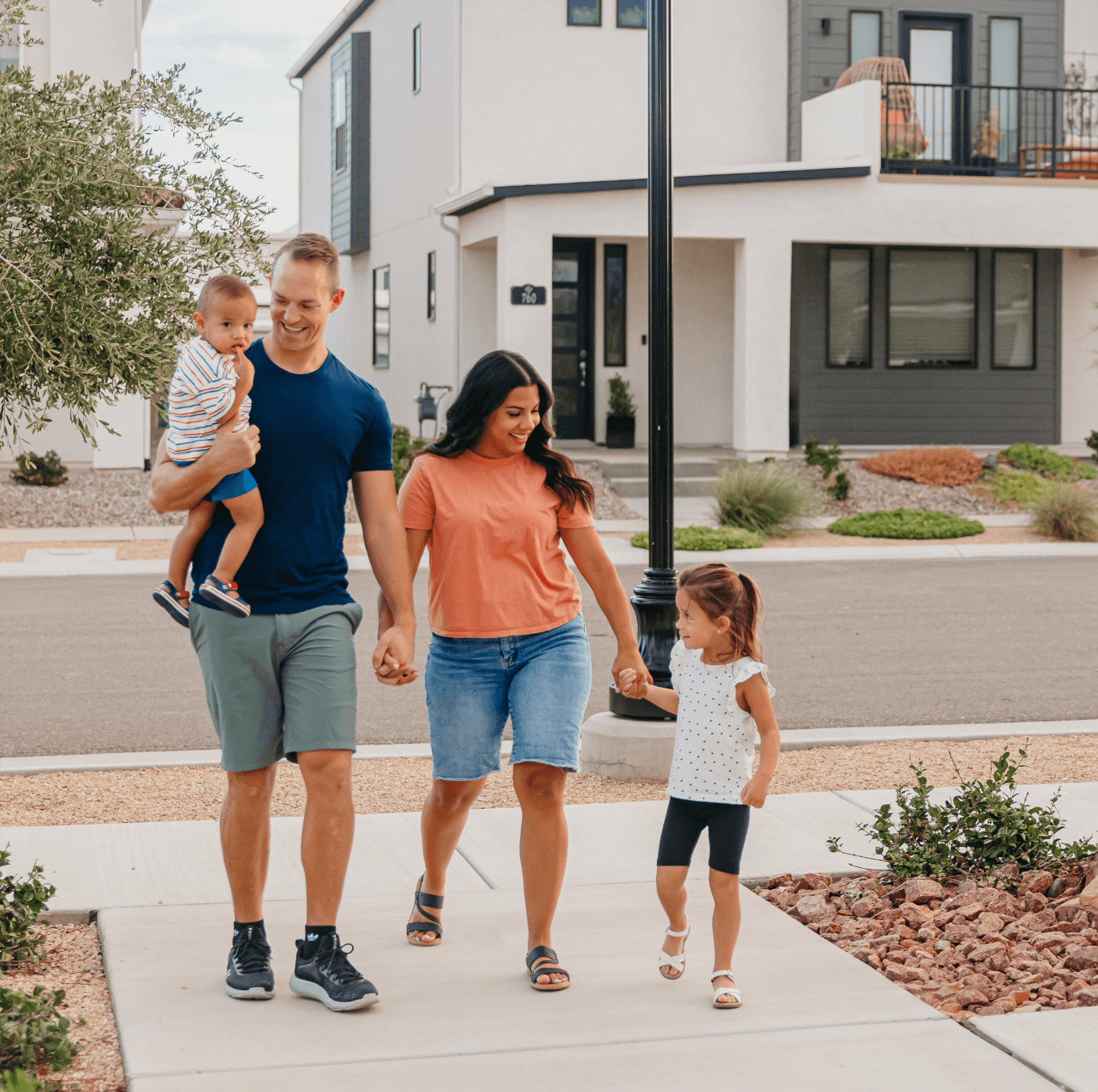 family walking towards house