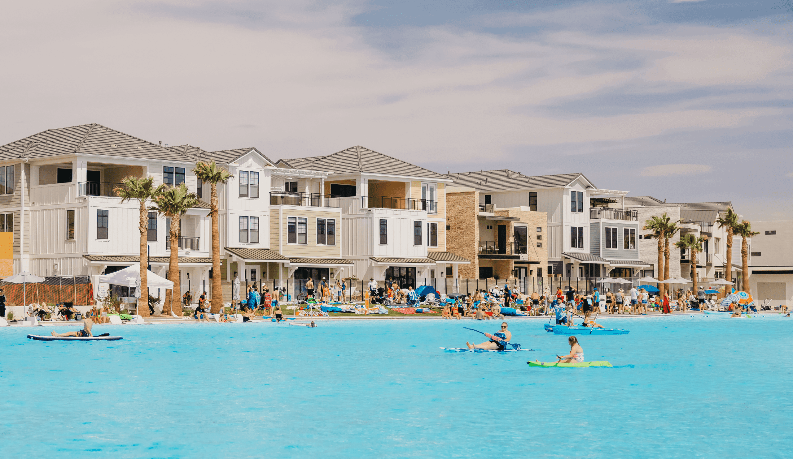 families paddle boarding in desert colors lagoon
