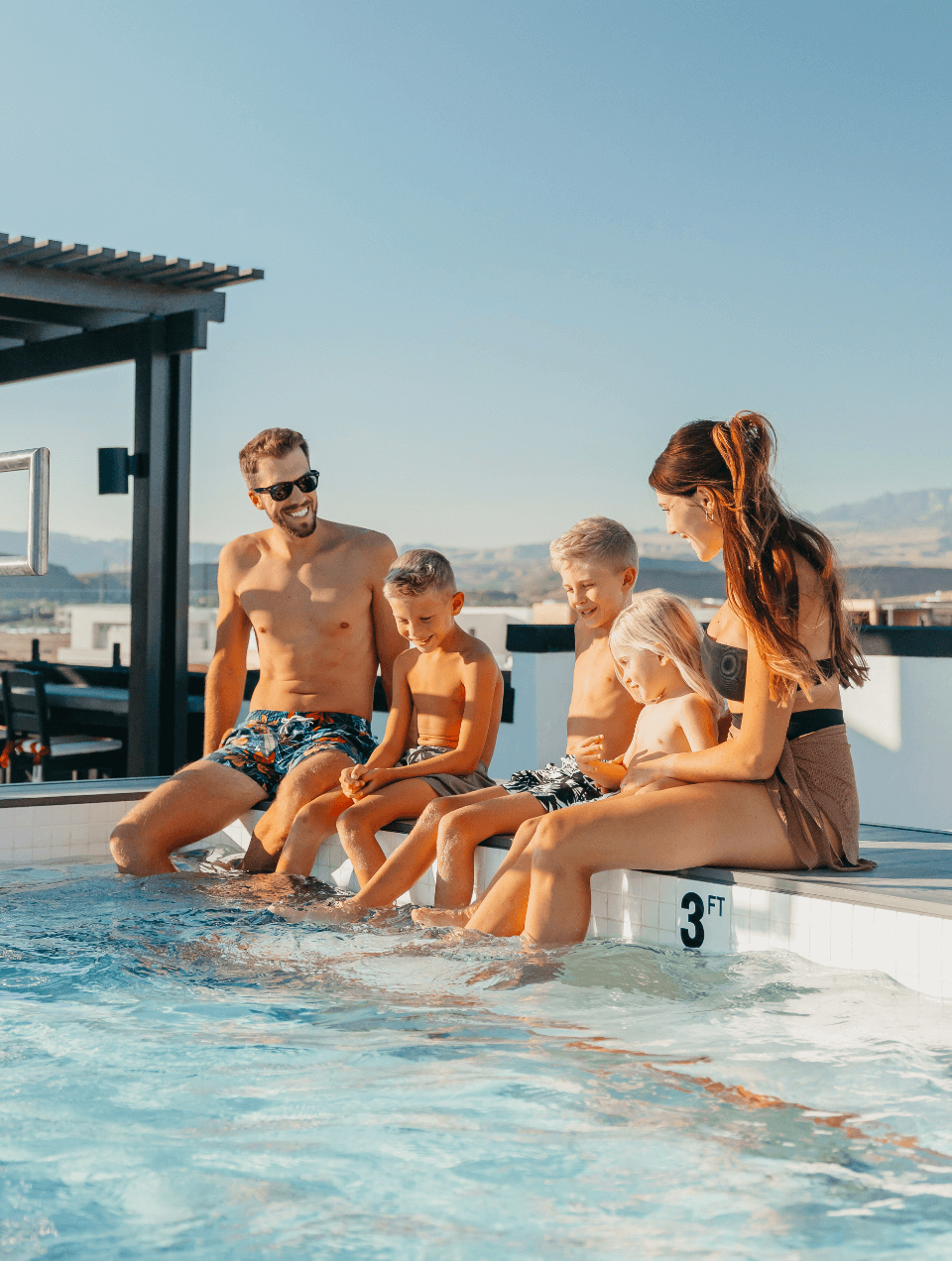 Family enjoying the pool at desert color