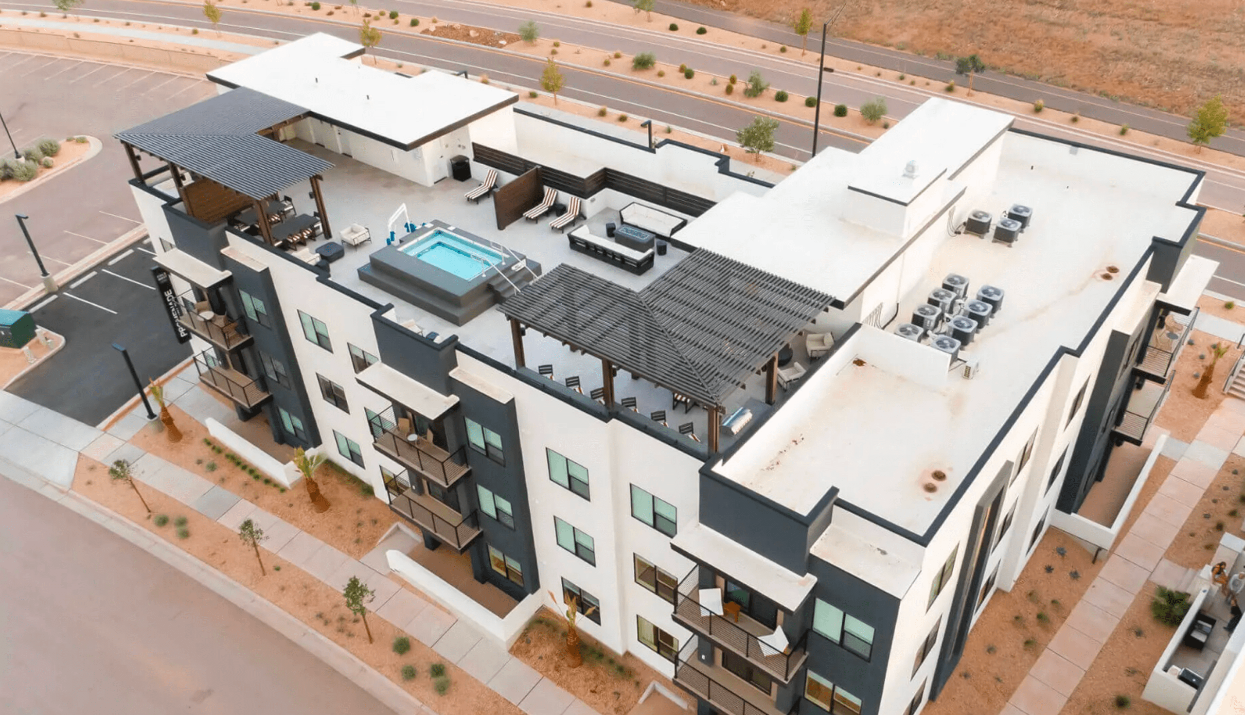 The rooftop of a modern apartment building in desert.